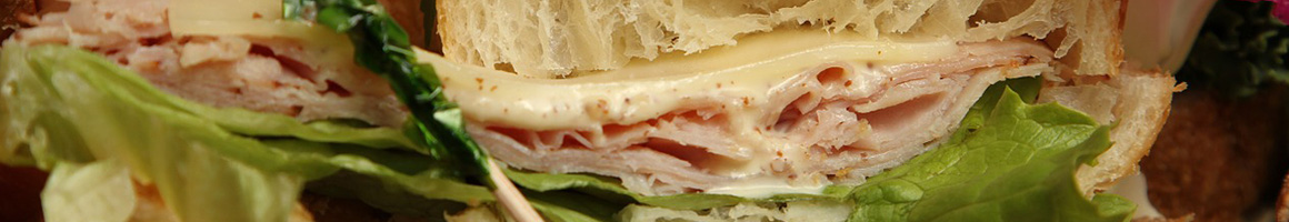Eating Sandwich at Heidi's Brooklyn Deli restaurant in Auburn, ME.